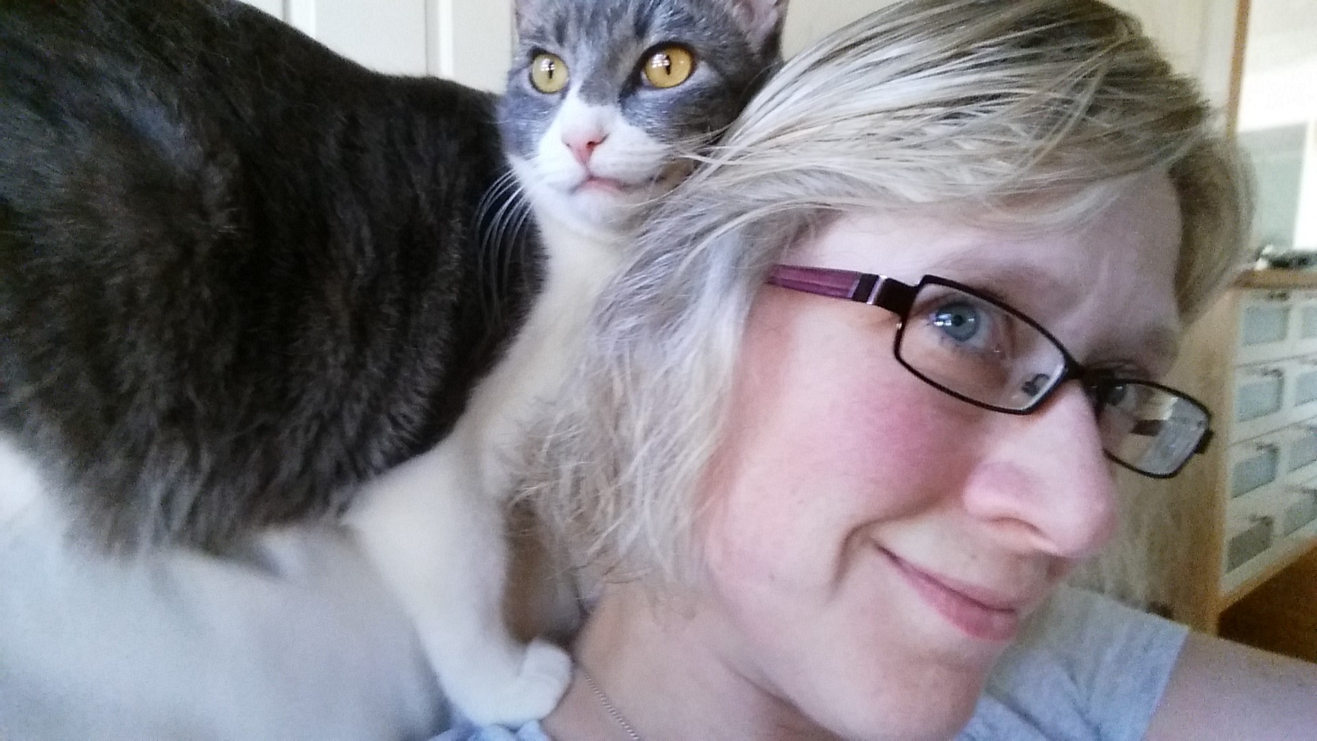 Abby Kingsbury and a grey and white cat